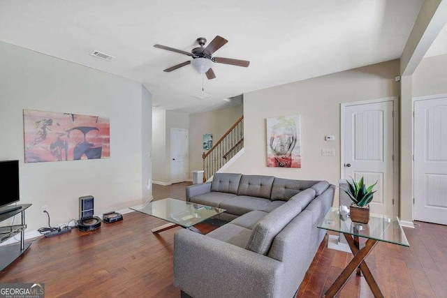 living room featuring hardwood / wood-style flooring and ceiling fan