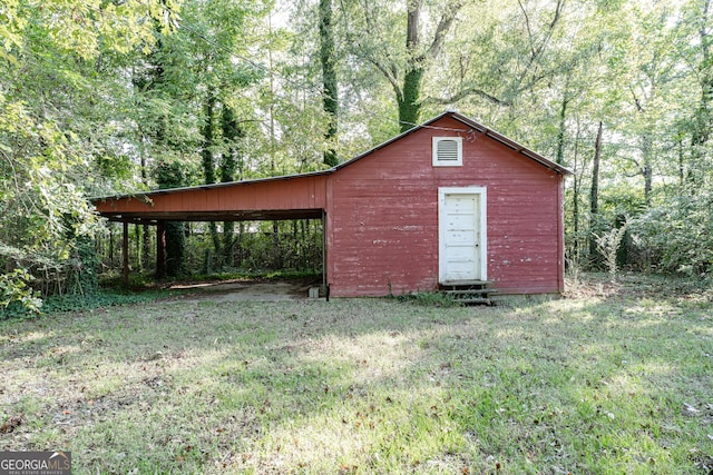 view of outdoor structure with a lawn