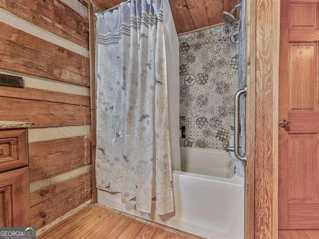 bathroom with wood ceiling, wood-type flooring, and shower / bath combo with shower curtain