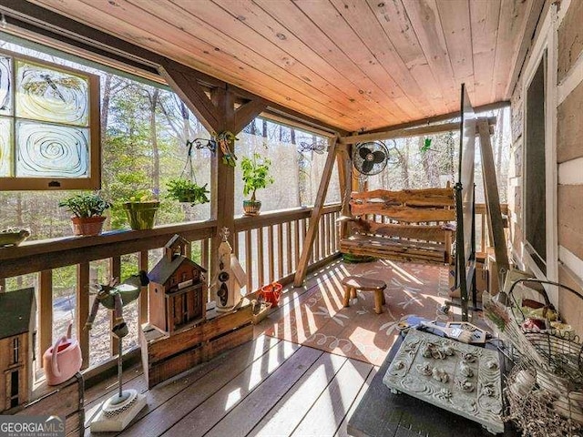 sunroom / solarium with wood ceiling