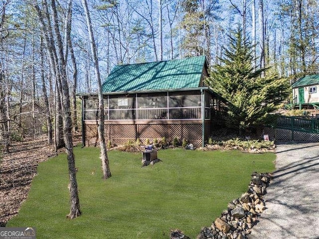 view of yard with a sunroom