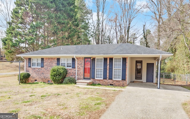 ranch-style home with a carport and a front yard