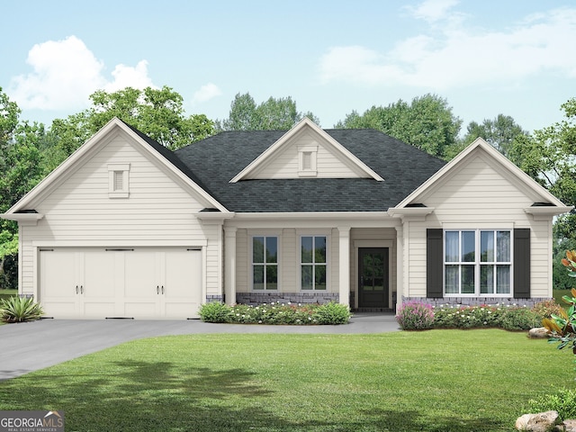 view of front of home with a garage and a front lawn