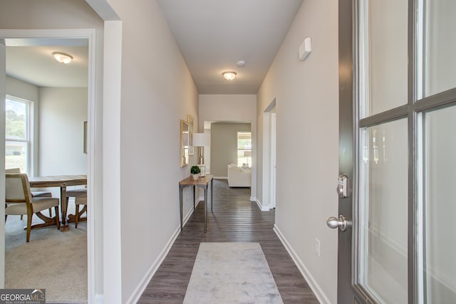 hallway featuring dark hardwood / wood-style floors