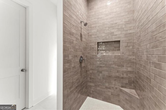 bathroom featuring tiled shower