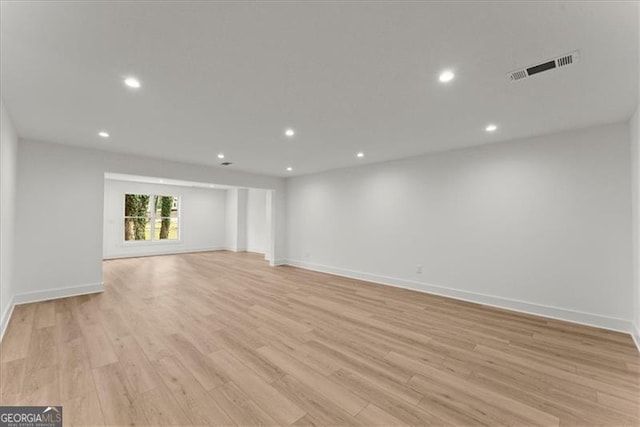 unfurnished living room with light hardwood / wood-style flooring