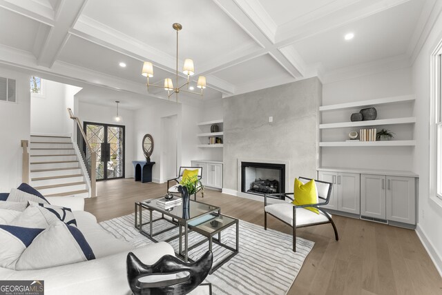 kitchen featuring white cabinetry, a kitchen bar, a kitchen island, and stainless steel refrigerator with ice dispenser