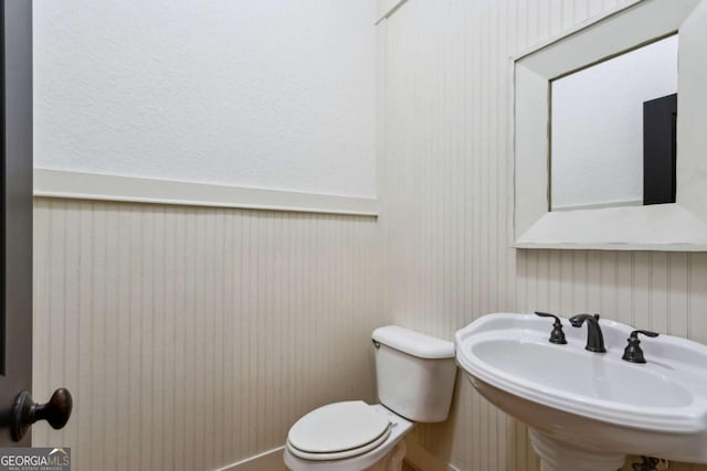 bathroom with toilet and sink