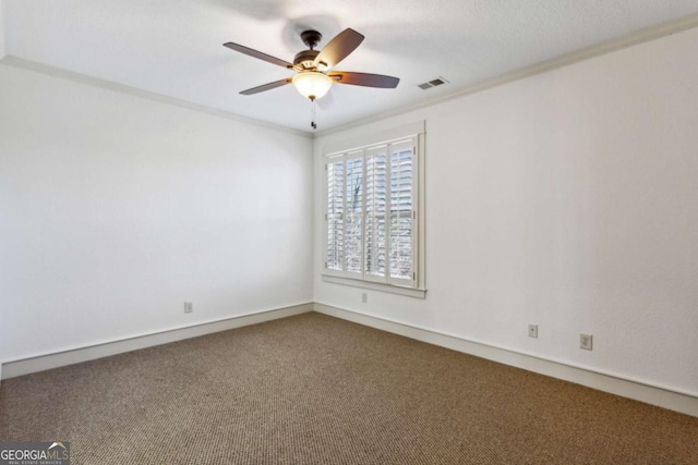 carpeted empty room with crown molding and ceiling fan