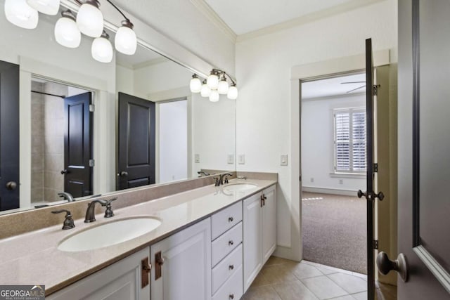 bathroom with vanity, tile patterned flooring, and ornamental molding