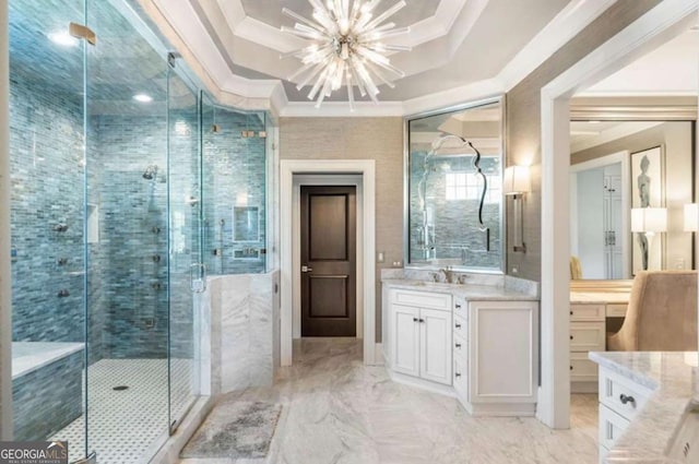 bathroom featuring vanity, a shower with door, ornamental molding, and a raised ceiling