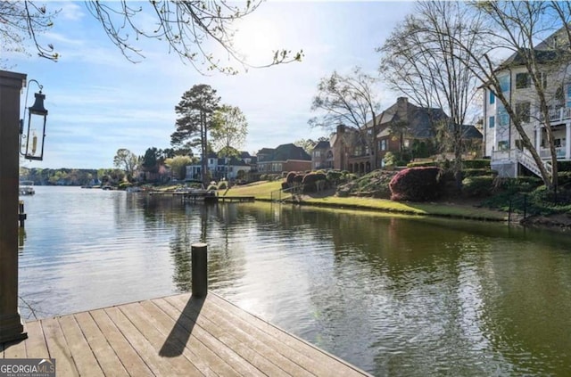 dock area featuring a water view