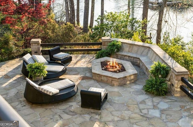 view of patio with a fire pit