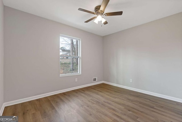 spare room featuring ceiling fan and wood-type flooring