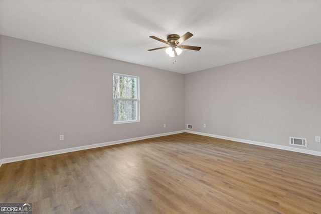 unfurnished room featuring ceiling fan and light hardwood / wood-style floors