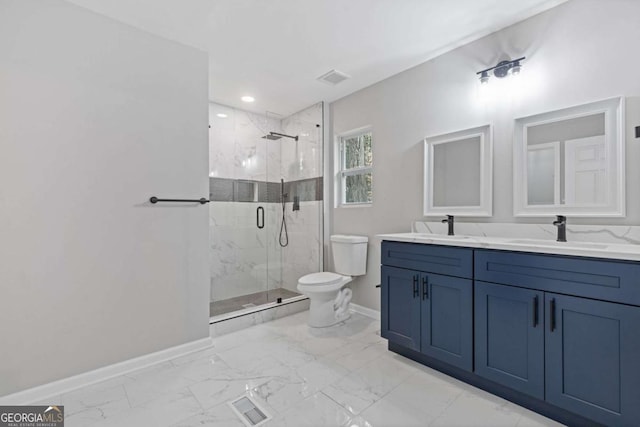 bathroom featuring a shower with door, vanity, and toilet