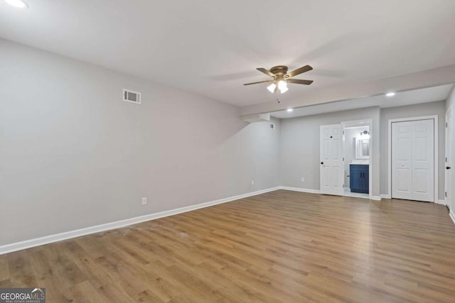 interior space with ceiling fan and light wood-type flooring