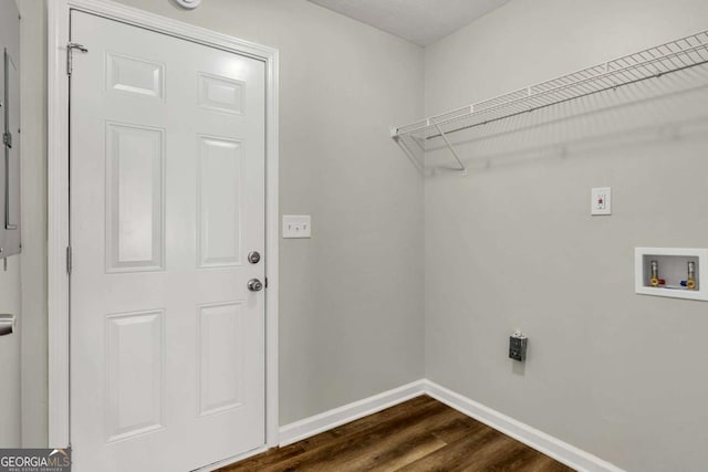 laundry area with hookup for a washing machine, hookup for an electric dryer, and dark hardwood / wood-style flooring