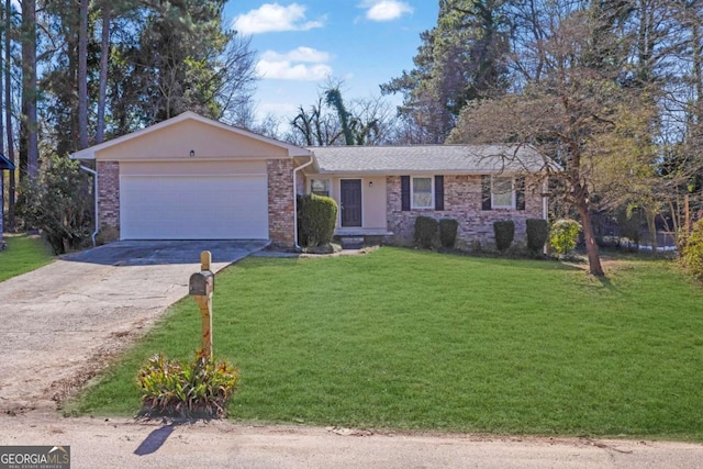 ranch-style house featuring a garage and a front yard