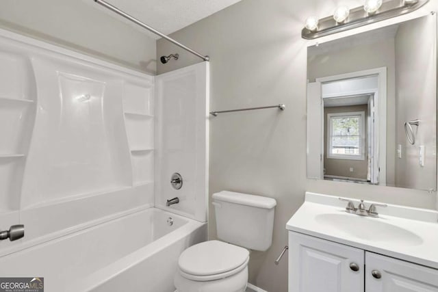 full bathroom featuring vanity, shower / washtub combination, and toilet