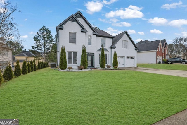 view of front facade with a garage and a front yard