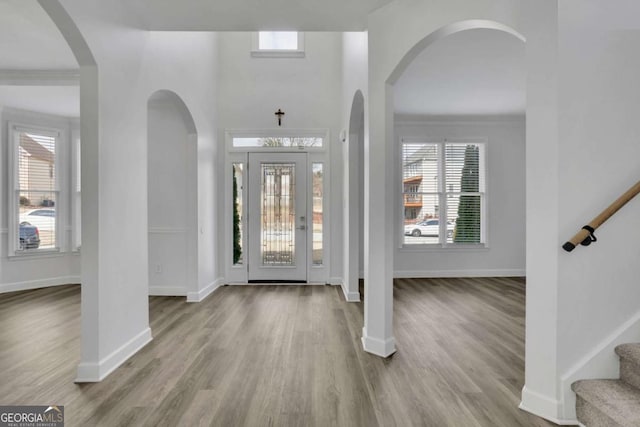 entryway featuring light wood-type flooring and a wealth of natural light