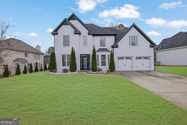 view of front facade featuring a garage and a front lawn