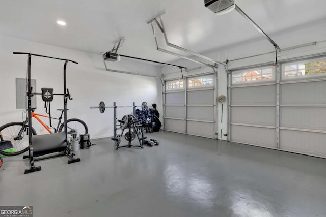 garage featuring a garage door opener and electric panel