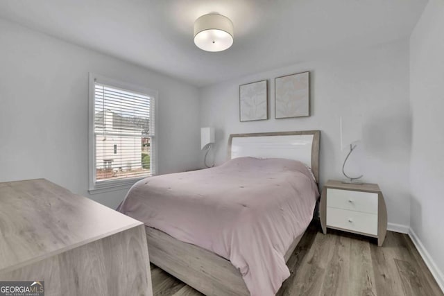 bedroom featuring hardwood / wood-style flooring