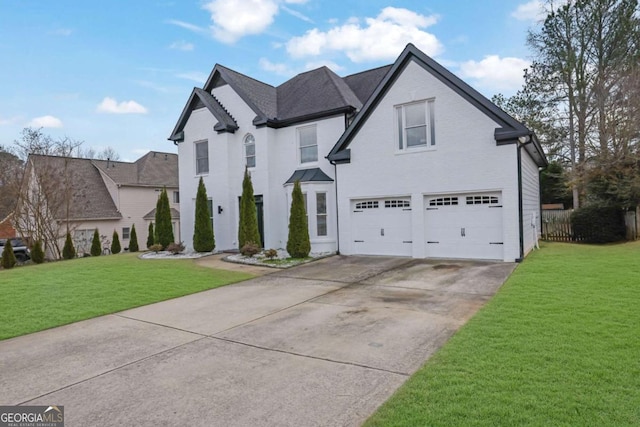 view of front facade featuring a garage and a front yard