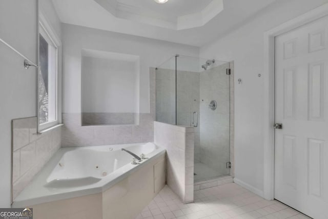 bathroom with tile patterned flooring, crown molding, independent shower and bath, and a raised ceiling