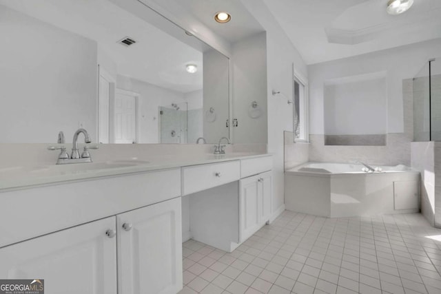 bathroom featuring vanity, independent shower and bath, and tile patterned flooring