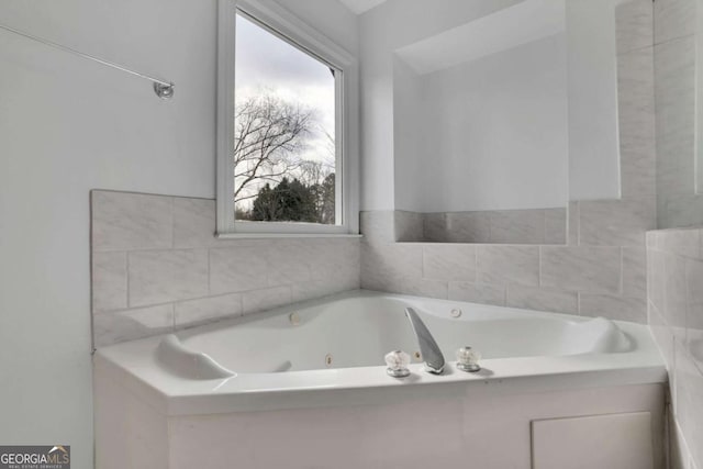 bathroom featuring a washtub