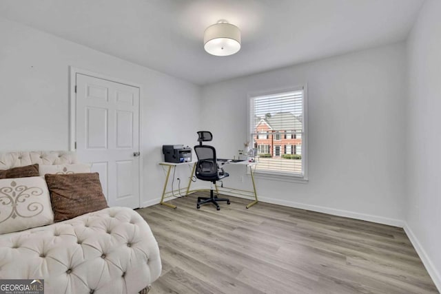 office area with light hardwood / wood-style flooring