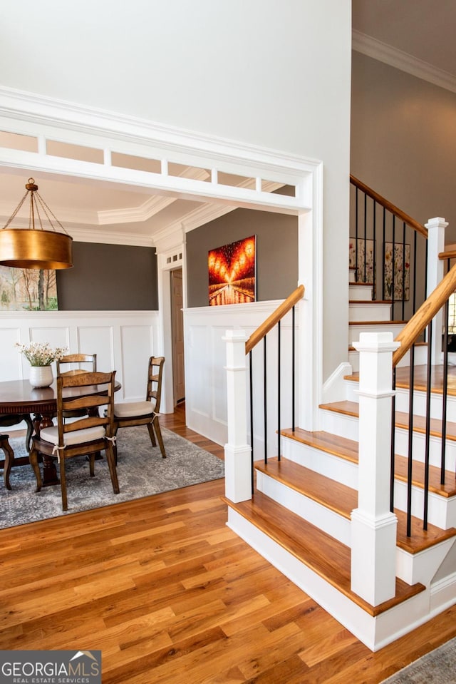 interior space featuring crown molding and hardwood / wood-style floors