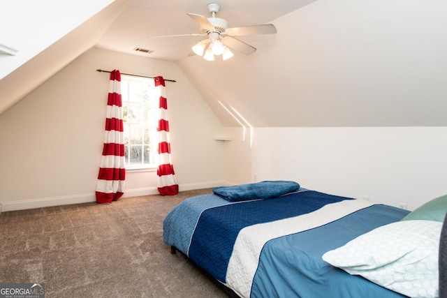 carpeted bedroom with ceiling fan and lofted ceiling