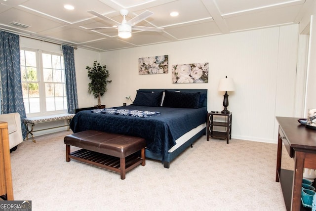 bedroom with coffered ceiling, ceiling fan, and carpet flooring