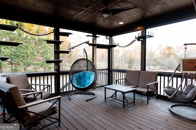 deck with ceiling fan and outdoor lounge area