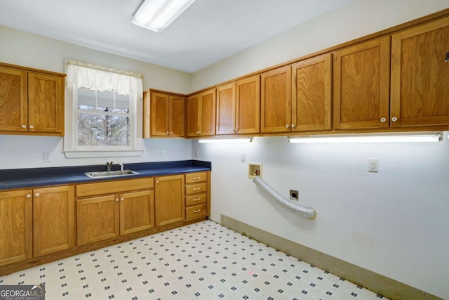 laundry room with washer hookup, sink, and cabinets