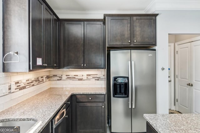 kitchen with crown molding, appliances with stainless steel finishes, backsplash, and dark brown cabinetry