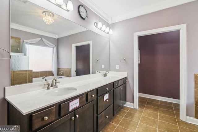 bathroom with tile patterned flooring, ornamental molding, and vanity