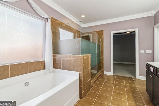 bathroom featuring vanity, tile patterned flooring, ornamental molding, and independent shower and bath