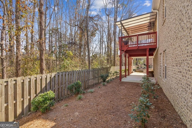 view of yard with a patio and a deck