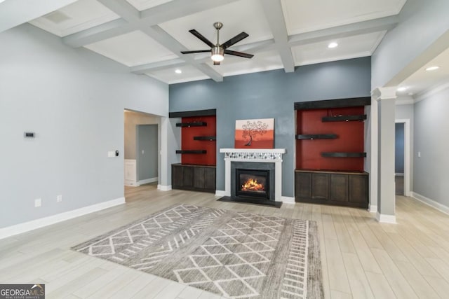 living room with coffered ceiling, light hardwood / wood-style flooring, beamed ceiling, and ceiling fan