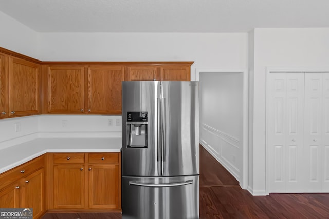 kitchen with stainless steel refrigerator with ice dispenser and dark hardwood / wood-style floors