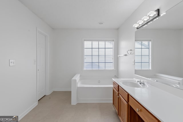 bathroom featuring vanity and a bath