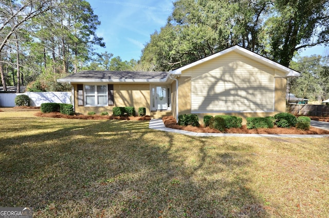 single story home featuring a front yard