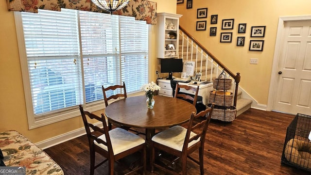 dining area with stairway, wood finished floors, and baseboards