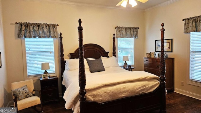 bedroom with a ceiling fan, baseboards, crown molding, and wood finished floors