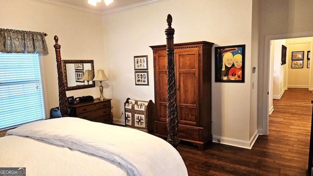 bedroom featuring dark wood-style floors, ornamental molding, and baseboards